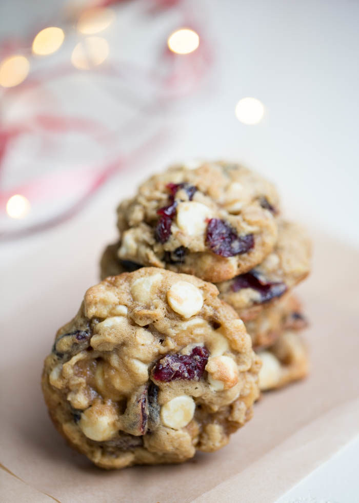 Tender, buttery oatmeal cookies packed with melty white chocolate chips and tart dried cranberries. Perfect for the holidays but a favorite year-round cookie too!