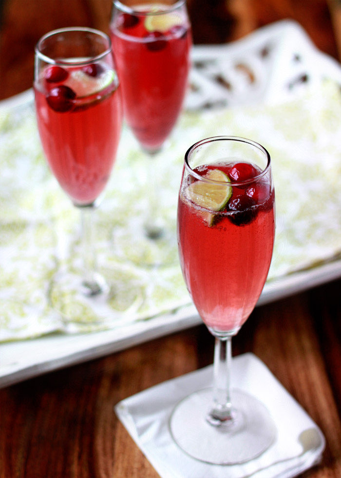 Cranberry-Lime Champagne Cocktail recipe - with only 3 ingredients, this super-simple champagne cocktail is perfect for the holidays.