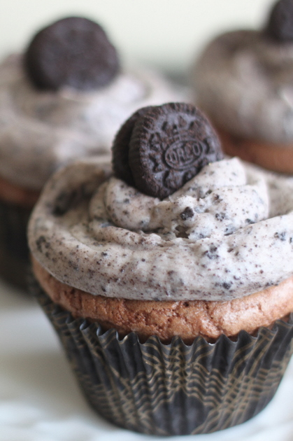 Cookies & Cream Oreo Brownie Cupcakes - Super-easy one-bowl brownie cupcakes with an Oreo cookie baked right in the middle, then topped off with a fluffy cookies-and-cream buttercream.