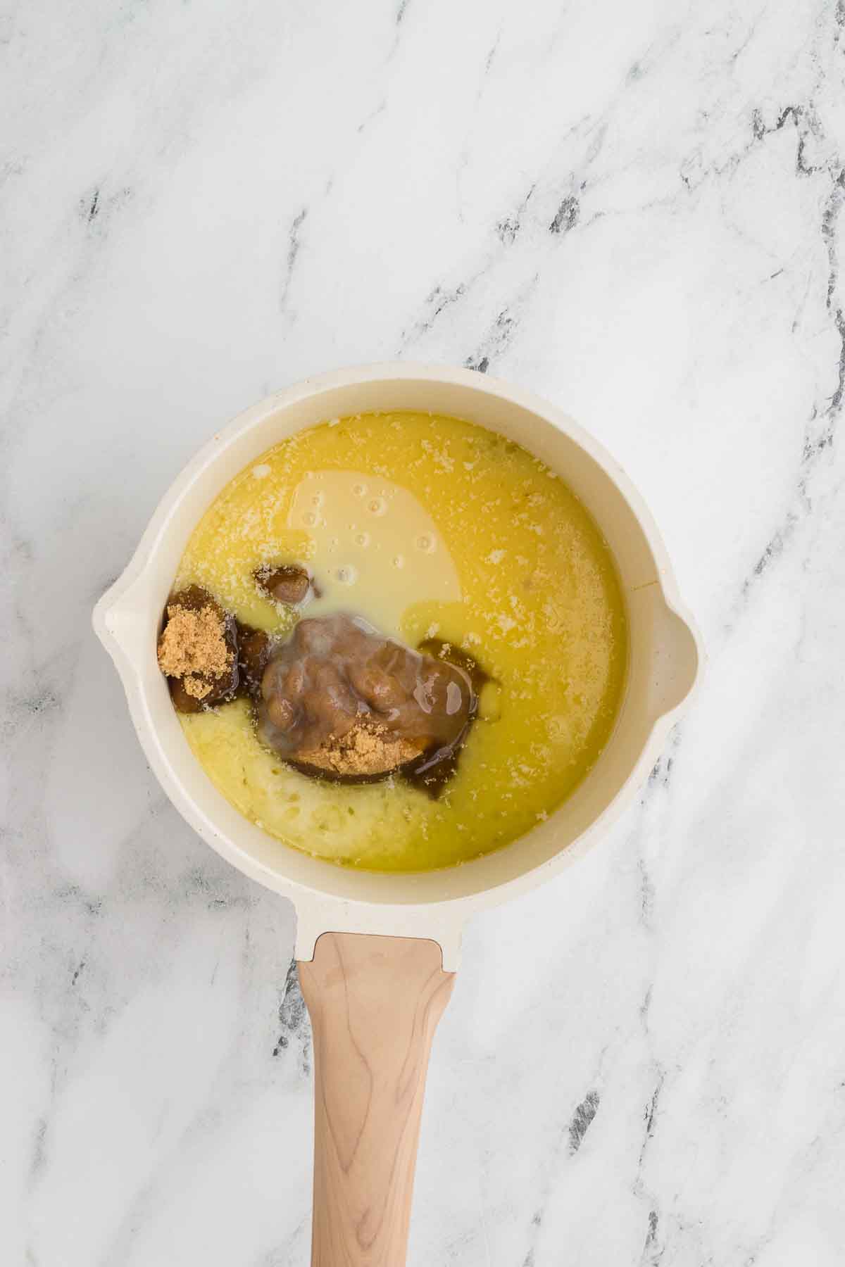 caramel apple dip ingredients in a saucepan