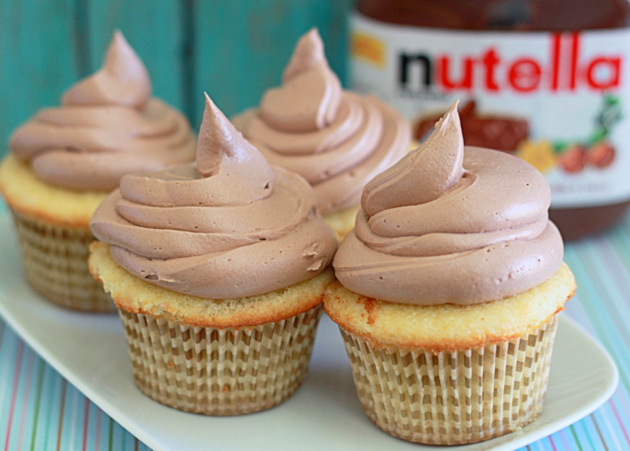 Fluffy Nutella Buttercream Frosting recipe! This fluffy - and super easy - buttercream frosting recipe features everyone's favorite chocolate-hazelnut spread. One batch of this buttercream should be plenty to frost one standard-sized layer cake or generously top a dozen cupcakes.