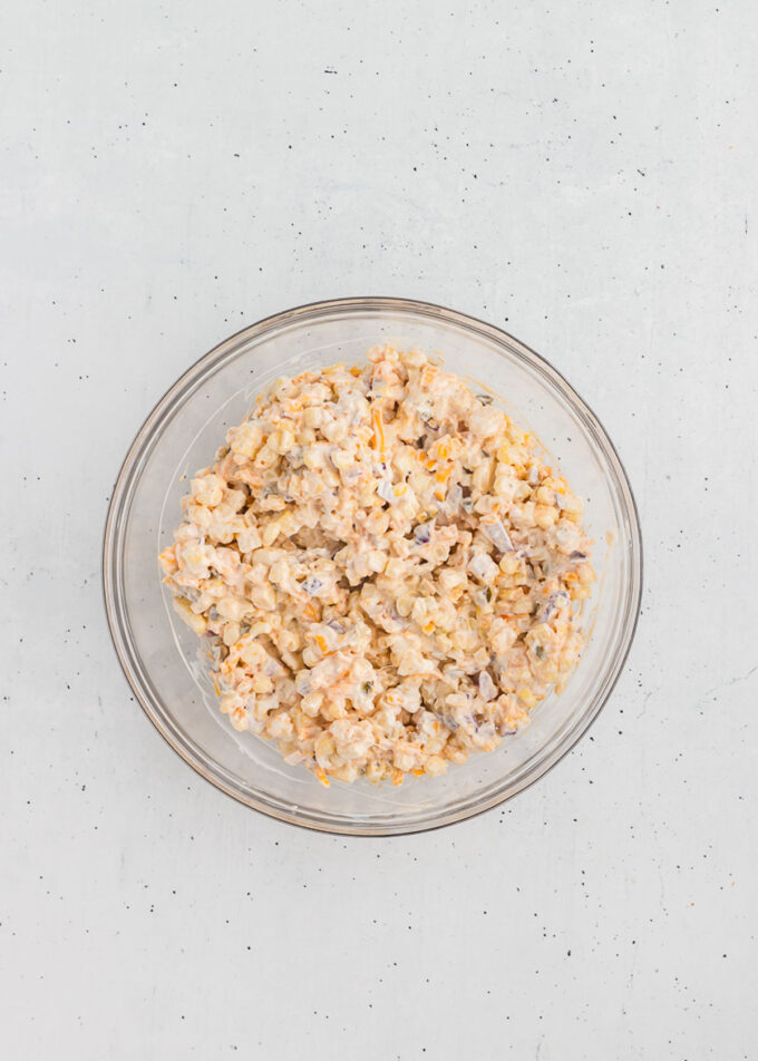 Mexican corn dip in a mixing bowl