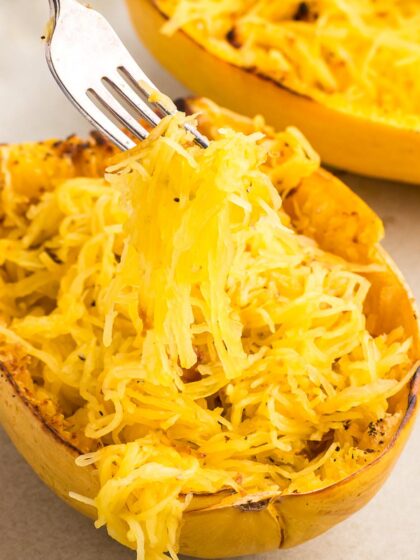 fork lifting the strands out of spaghetti squash