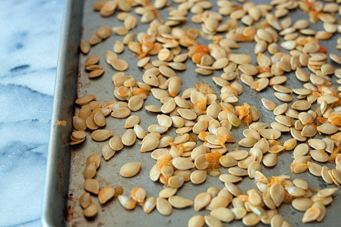 Delicious, healthy pumpkin seeds are the best pumpkin-carving snack. Whether you're pureeing your own pumpkin or creating your jack o'masterpiece, don't let these little gems go to waste! They're easy to roast to crunchy, addicting perfection. Here's the step-by-step on how to roast pumpkin eeds, plus 3 tasty flavor variations: Kettle Corn Style; Sweet, Spicy, & Savory; and Salt & Pepper