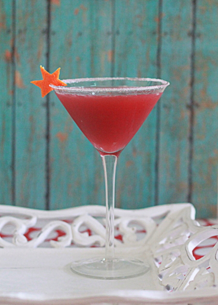 Pomegranate-Orange Martini recipe - This fruity, sassy vodka martini pairs tart pomegranate and juicy orange for a rosy cocktail that's perfect for holiday parties.