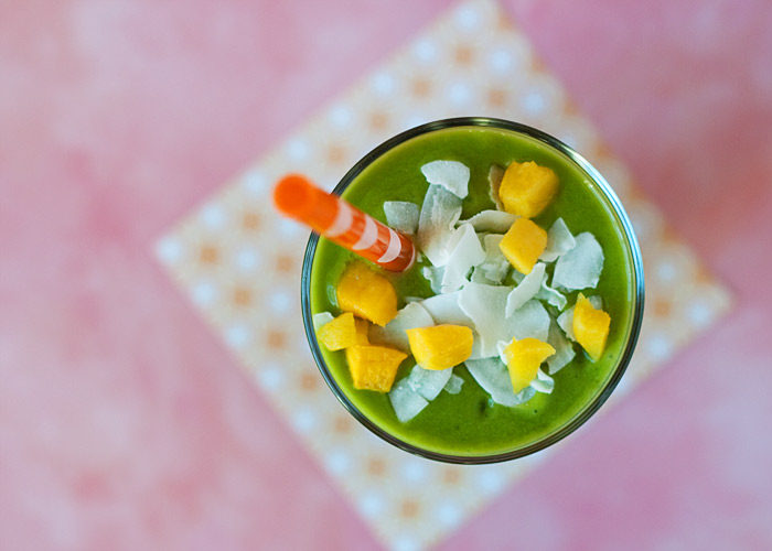 Vegan Mango-Coconut Green Smoothie recipe - With its light coconut milk base (no dairy here) this tropical vegan green smoothie is utterly creamy and coconutty. Tastes like a day at the beach!