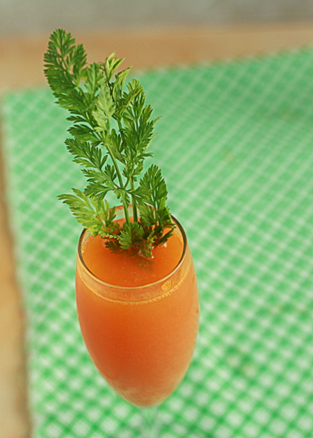 Carrot Mimosas recipe - Carrot juice and Prosecco combine to make these cute, kitschy mimosas that couldn't be more perfect for Easter.