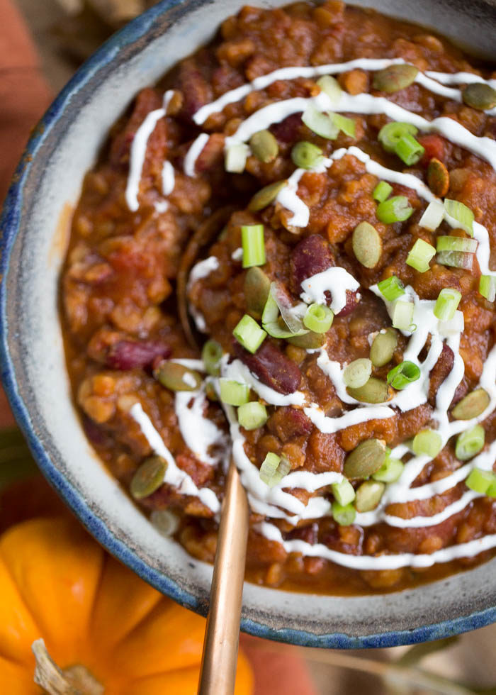 This slow cooker pumpkin red lentil chili is just different enough to be special, but it’s mainstream enough to appeal to most everyone. The perfect fall chili and SO easy to make! #vegetarian #vegan #glutenfree #pumpkinchili #vegetarianpumpkinchili