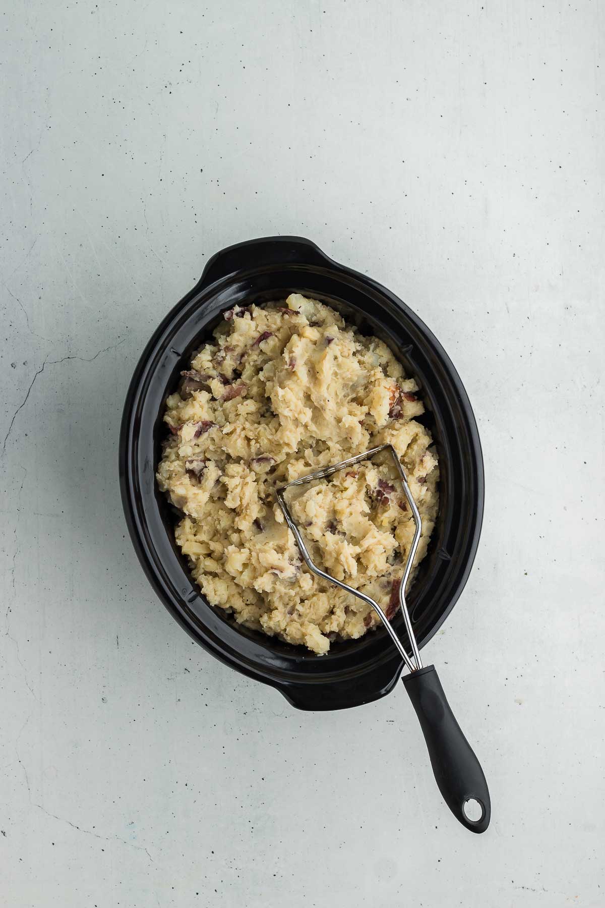 mashing Crock Pot Mashed Red Potatoes