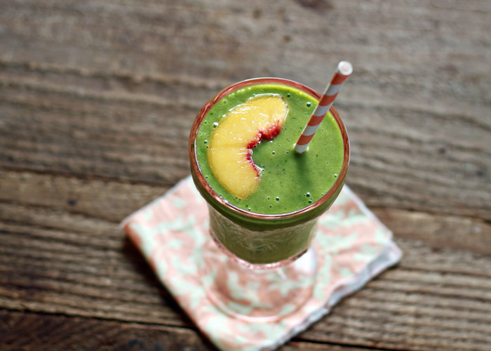 Juicy ripe peaches and a zing of ginger give this Ginger Peach Green Smoothie a bit of zip and whole lot of sass.