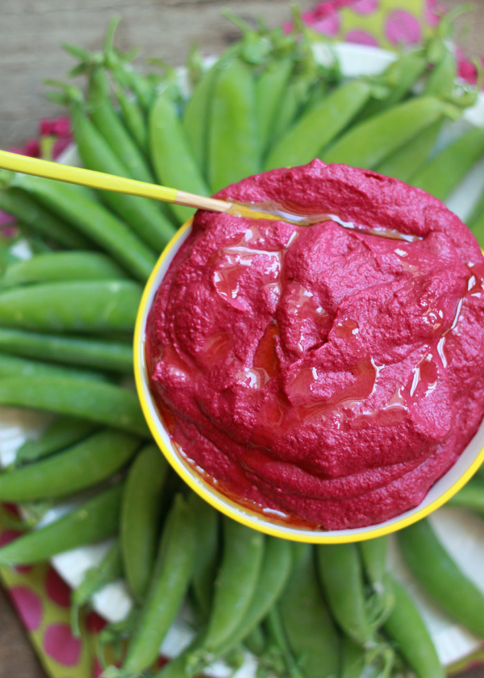 Roasted Beet Hummus recipe - So easy to make! Take a couple of beets, roast them until tender, then puree with chickpeas, tahini, garlic, lemon - all that hummus-y good stuff. Equally tasty with pitas or peas! Perfect vegan appetizer recipe.