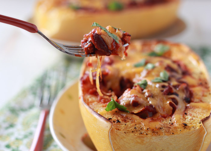 Chili Cheese Stuffed Spaghetti Squash - Melty cheddar and tangy chili make this a squash for squash haters. Who can turn down chili and cheese?! Make it your own by using any chili you want (perfect for leftovers!)