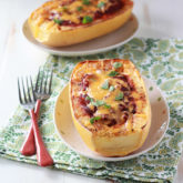 Chili Cheese Stuffed Spaghetti Squash - Melty cheddar and tangy chili make this a squash for squash haters. Who can turn down chili and cheese?! Make it your own by adding any chili you want (perfect for leftovers!)