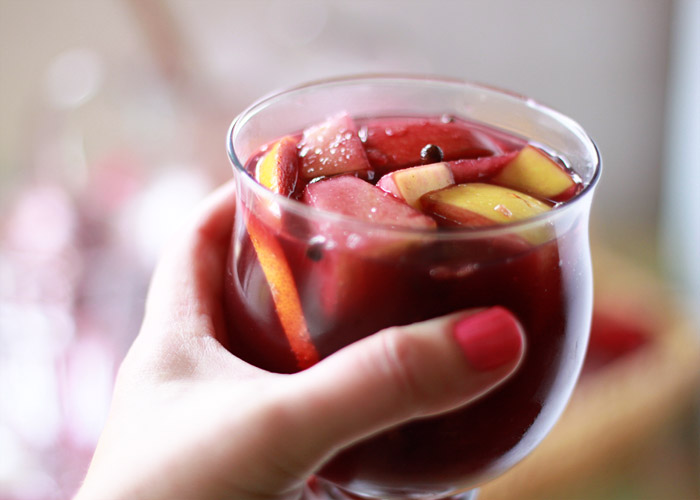 Classic Red Sangria Recipe - A simple (but potent!) red wine sangria with apples, oranges, allspice, and brandy. A splash of zesty ginger beer tops it off. Beware, this goes fast!