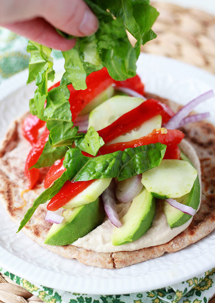 Vegan Hummus, Roasted Red Pepper, & Avocado Gyros recipe - Creamy hummus and smoky roasted red peppers make for a scrumptious vegan gyro.