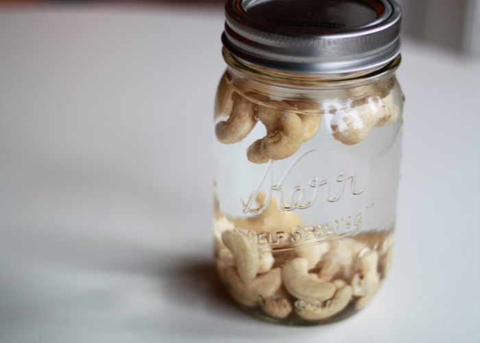 Cashews soaking in a mason jar for cashew coffee creamer