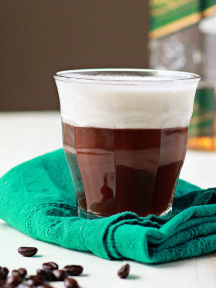 Vegan Irish Coffee recipe - Creamy coconut whipped cream floats dreamily atop spiked whiskey-spiked coffee for this vegan version of the classic cocktail.