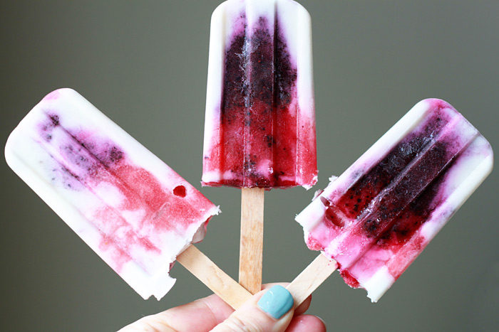 Coconut Berry Firecracker Ice Pops - Only 5 ingredients go into these creamy homemade dairy-free popsicles made with coconut milk, strawberries, and blueberries. 