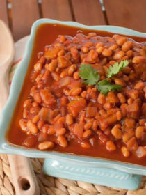 Slow Cooker Mango BBQ Baked Beans - Tangy, saucy, and savory-sweet, these easy (and vegan!) Crock Pot beans practically scream "summer barbecue!"