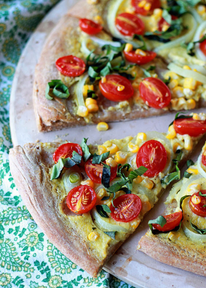 Vegan Summer Pizza with Sweet Corn, Tomatoes, and Basil - Pizza without cheese? Believe it or not, it can be utterly delicious! This summertime pizza with its creamy, garlicky sauce and peak-season produce is proof.