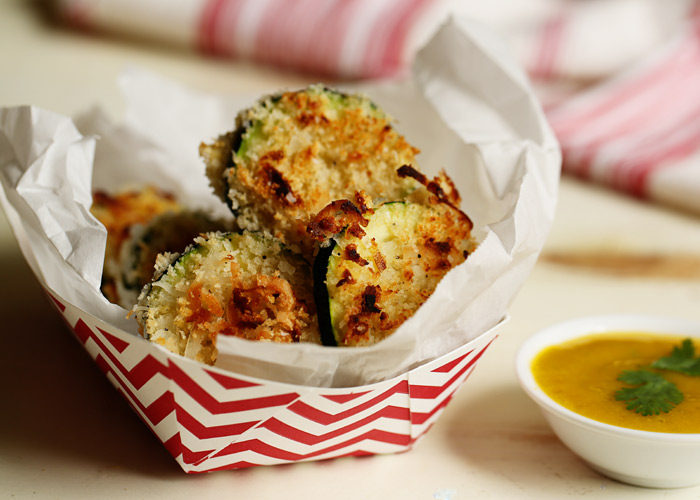 Seriously nosh-worthy, this recipe for Crispy Baked Coconut Zucchini gives zukes a tropical twist. That irresistible Mango-Jalapeno Dipping Sauce seals the deal. 