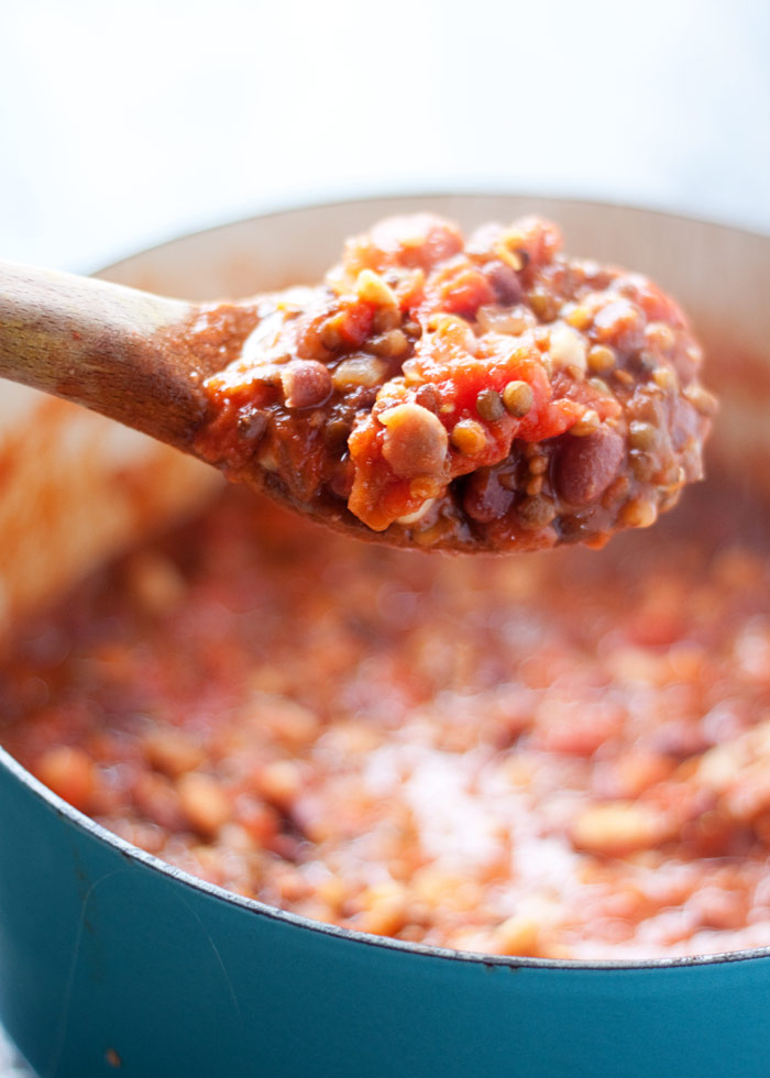 A spoonful of vegetarian bolognese as it cooks in the pot. 