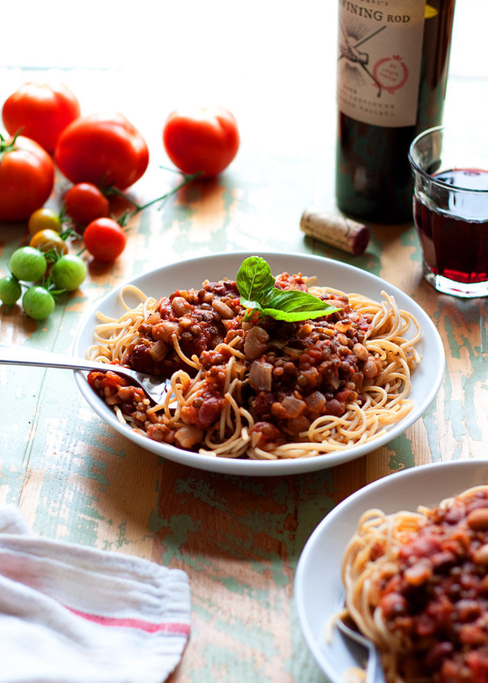 Hearty Bean & Lentil Vegan Bolognese Recipe - Tomatoes and garlic simmered together with lentils and beans for a thick, hearty, and protein-rich take on classic marinara. Vegetarian/vegan.