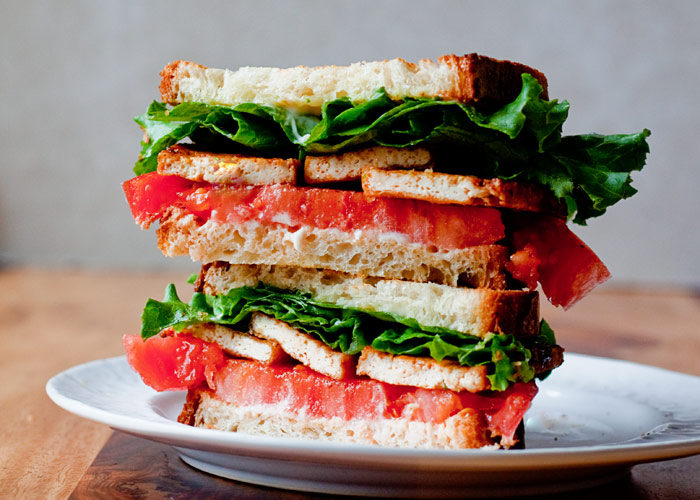 Tofu, quickly seared and seasoned, is the "meat" of these hearty TLTs - Smoky Tofu, Lettuce, and Tomato Sandwiches. With options for meat-eaters, gluten-free, or vegans!