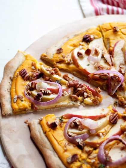 Vegan Butternut Squash Pizza with Apples & Pecans recipe. Who knew? Butternut squash makes a silky-smooth and full-flavored pizza sauce - the perfectly creamy base for this fall-inspired pie.