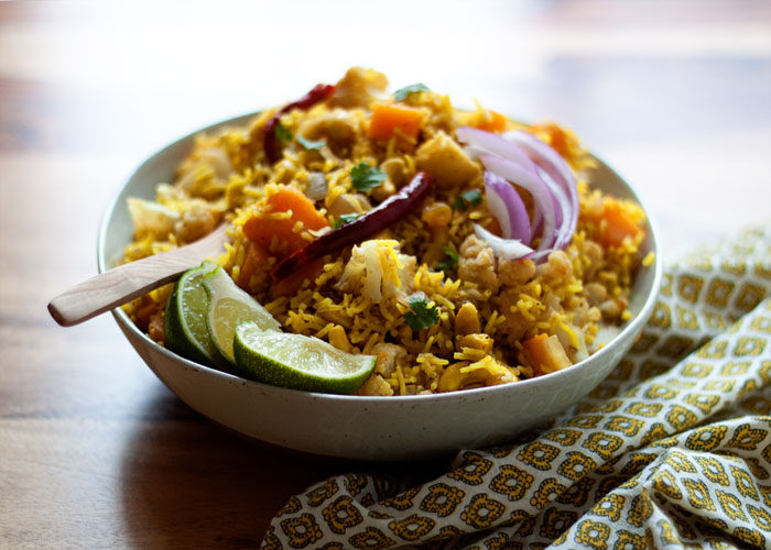 Biryani-Inspired Indian Vegetable Rice - This Indian-influenced, aromatic rice dish boasts butternut squash, cauliflower, cashews, golden raisins, and autumn-perfect flavors. And it's one of my favorite recipes for fall! Vegan and gluten-free.