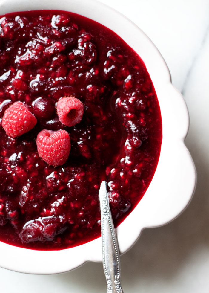 Raspberry Zinfandel Cranberry Sauce recipe - Red wine, raspberries, and cinnamon make for a special - yet still surprisingly simple - homemade cranberry sauce. Tart, just a bit jammy, and warmly spiced. Honey-sweetened (with vegan options). Love! 