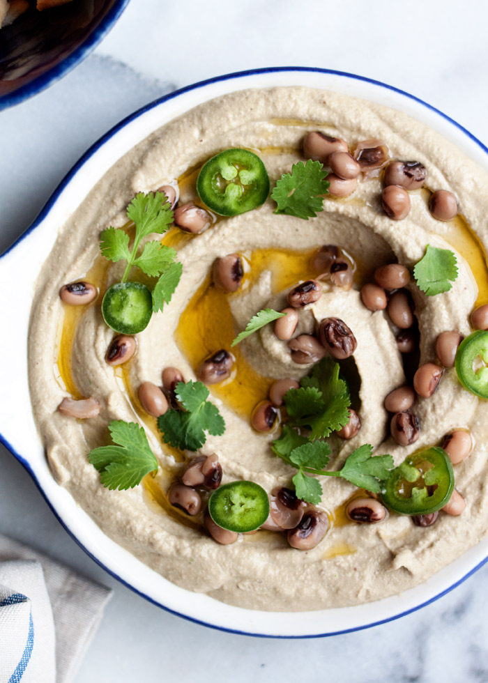 Jalapeno Black-Eyed Pea Hummus recipe - A fun twist on classic hummus, with lucky black-eyed-peas in place of the chickpeas. Spicy jalapenos add the perfect touch of heat.