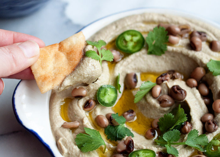 Jalapeno Black-Eyed Pea Hummus recipe - A fun twist on classic hummus, with lucky black-eyed-peas in place of the chickpeas. Spicy jalapenos add the perfect touch of heat.