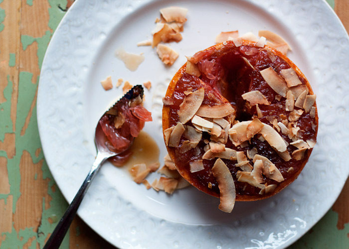 Coconut Ginger Broiled Grapefruit recipe - Fresh ginger and coconut sugar top grapefruit halves and are broiled until caramelized and brulee-esque. Top with toasted coconut to take them over the top. Perfect for a special breakfast or brunch, but also ideal as a healthy(ish) dessert!