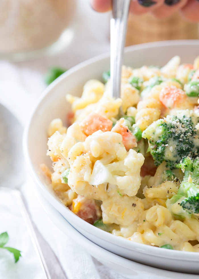 Veggie Lovers' Stovetop Mac and Cheese recipe - Love this creamy, cheesy, veggie-packed mac and cheese recipe! Broccoli, cauliflower, peas, and carrots join up with whole-wheat pasta plus three cheeses for comfort food with a veg-heavy twist.