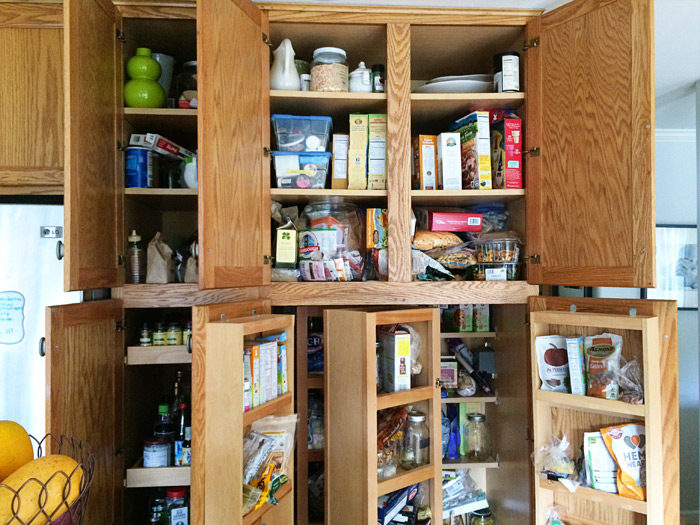 How We Organized Our Small Kitchen Pantry - This tiny pantry was whipped into shape with crisp white paint, some careful planning, lots of chalkboard labels, and more pantry organization ideas. 