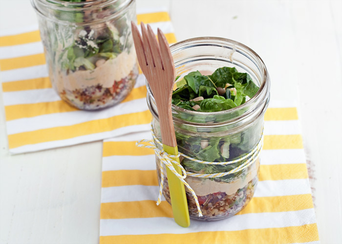 Tabbouleh Hummus Mason Jar Salads - Like a mini grain bowl on the move, these hearty, protein-packed mason jar salads are layered with tabbouleh, hummus, greens, and toasted pine nuts. So easy and, frankly, darn cute! Vegan with gluten-free option. 