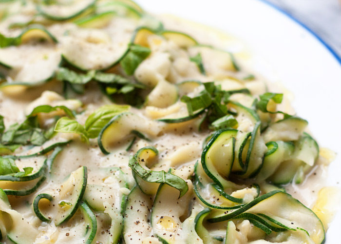 Zucchini Fettuccine with Creamy White Bean "Alfredo" Sauce recipe - A revelation! The rich and creamy sauce - made with only white beans, garlic, almond milk, a drizzle of olive oil plus salt and pepper - perfectly coats tender-to-the-bite zucchini ribbons. Only 5 ingredients and 15 minutes for this hearty and healthy gluten-free and vegan dinner. 