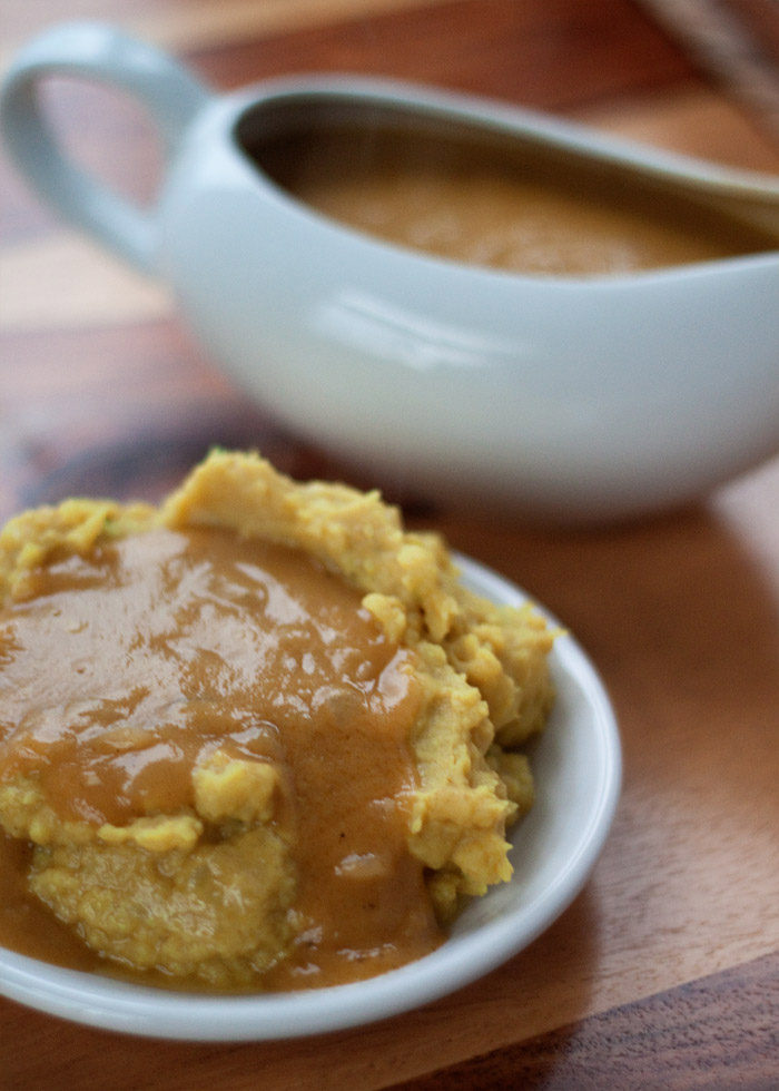 Indian-Spiced Vegan Brown Gravy recipe - Meatless gravy that's full of flavor! Sauteed onions, garlic, and ginger join up with a jolt of Garam Masala spices for a thick, rich gravy worthy of the holidays.