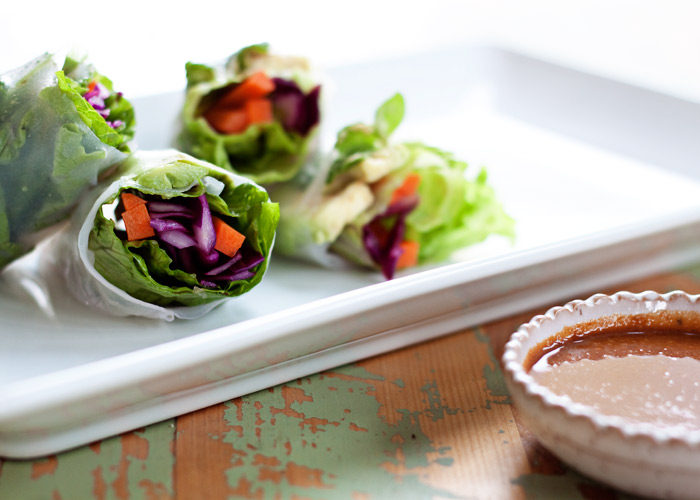 Fresh Avocado Summer Rolls with Peanut Dipping Sauce - Fresh, veggie-packed rolls with avocado, red cabbage, carrots, basil, and mint - all served up with a super easy peanut dipping sauce. Perfect appetizer or light summer dinner!