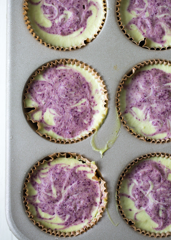 Frozen Mini Blueberry Key Lime Pies - Unbelievably creamy, refreshing, and possibly even borderline healthy, these vegan tarts are made with cashews, avocado, and loads of lime juice. A pureed blueberry swirl adds even more summery flavor and gorgeous color to boot. The perfect make-ahead, plant-based dessert for summer parties!