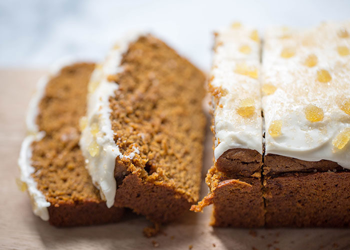 Spiced Pumpkin Gingerbread with Maple-Vanilla Icing recipe - This rich, splurge-worthy gingerbread is pimped out for fall, with pumpkin puree, fall spices, and a decadent layer of thick maple-vanilla icing smothered over the top. If you really want to go for it, be sure to add the coarse Demerara sugar and candied ginger as a final touch. Dairy-free. 