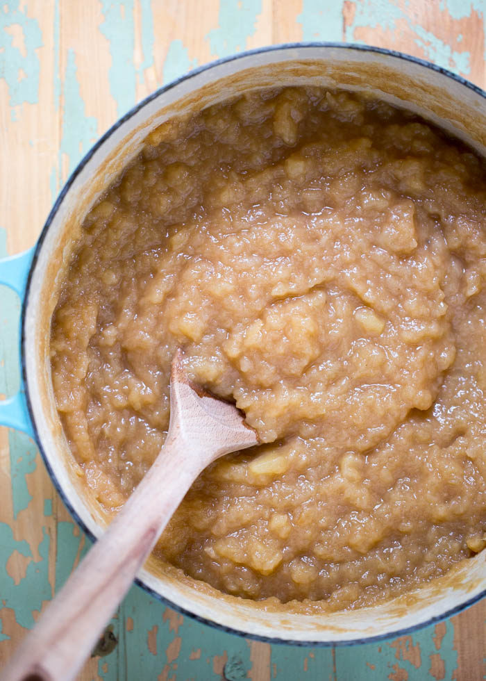 This homemade applesauce recipe boasts an unusual ingredient - pureed dates! And no refined sugar. Dates not only lend natural sweetness, but they give it a warm, caramelly note. So good! #applesauce #dates 