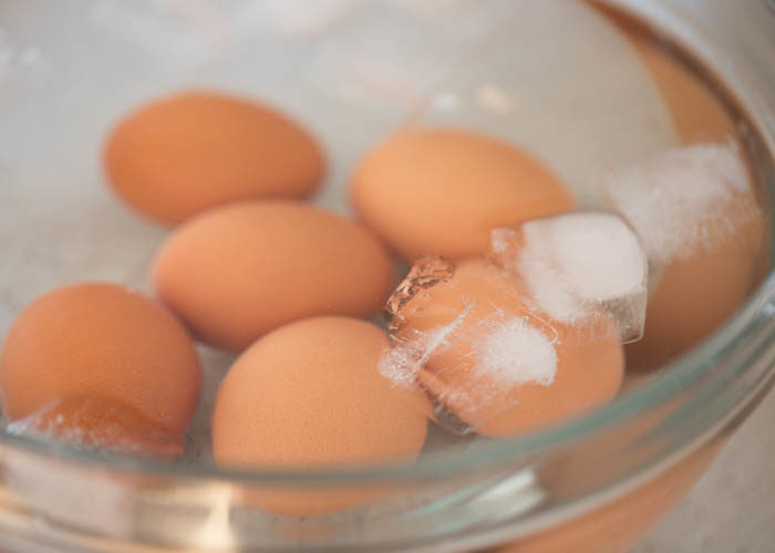 Cooling freshly cooked Instant Pot Hard Boiled Eggs in a bowl of ice water