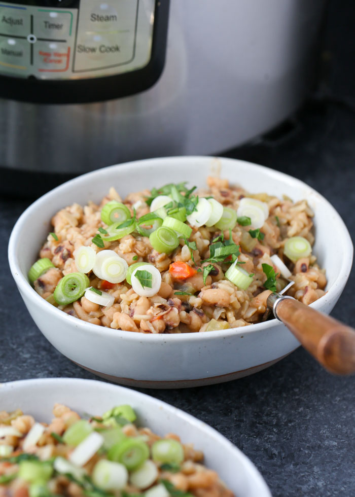 Instant Pot Vegan Hoppin' John - Black-eyed peas, rice, and veggies form this hearty, smoky meal-in-one. Make some for New Year's luck - or just because it's darn delicious! 