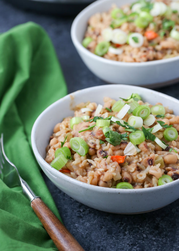 Instant Pot Vegan Hoppin' John - Black-eyed peas, rice, and veggies form this hearty, smoky meal-in-one. Make some for New Year's luck - or just because it's darn delicious! 