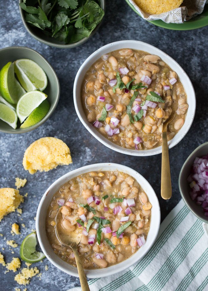 20-Minute Vegetarian White Bean Chili - I'm always surprised by how complex this tastes considering it only takes 20 minutes! Three kinds of beans add interest to this simple (and fast) vegetarian/vegan white bean chili recipe. A weeknight go-to around here! #whitebeanchili