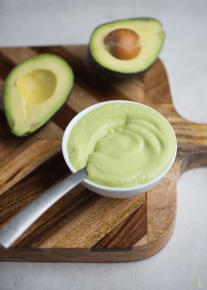 How to Make Avocado Hollandaise Sauce - Lemony, velvety, and even a bit buttery, this easy blender sauce is a surprisingly effective stand-in for the real thing. Plus, it's simple, fast, and healthy! Perfect for topping eggs benedict or dressing up steamed asparagus. #avocadohollandaise