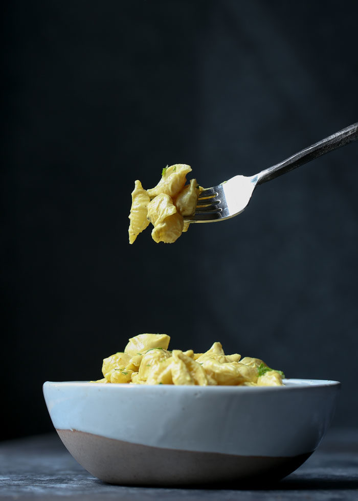 The ultimate vegan shells and cheese recipe. Fast, easy, and so tasty, it's even carnivore-approved. Reminiscent of the Velveeta classic, but SO much better! #veganmacandcheese