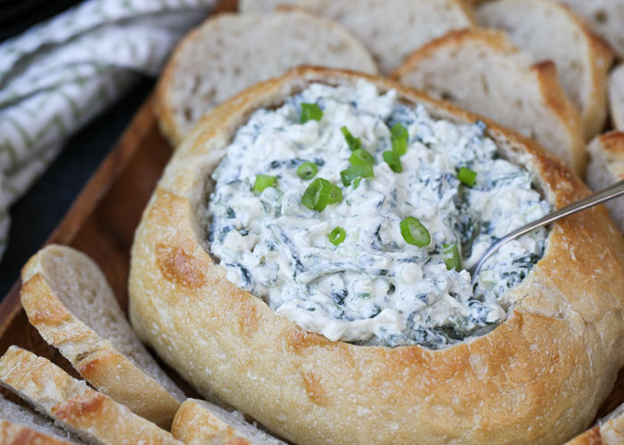 Creamy Spinach Dip with Water Chestnuts - The classic cold spinach dip, minus the veggie soup mix, served up in a sourdough bowl. Easy, addicting, with dairy-free and vegan options!